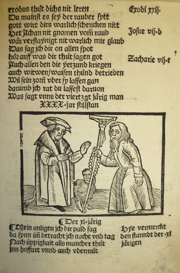 Ein bedrucktes Blatt in einer fremden Sprache mit zwei Männern im Hintergrund, möglicherweise aus einem Lehrbuch.