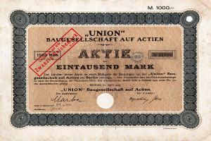 Ein alter deutscher Bankschein mit einem roten Stempel und Text, der darauf hinweist, dass es sich um ein Aktienzertifikat handelt.