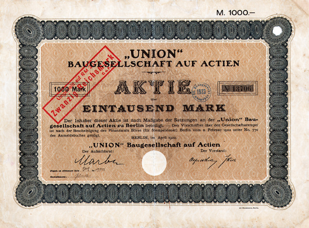 Ein alter deutscher Bankschein mit einem roten Stempel und Text, der darauf hinweist, dass es sich um ein Aktienzertifikat handelt.