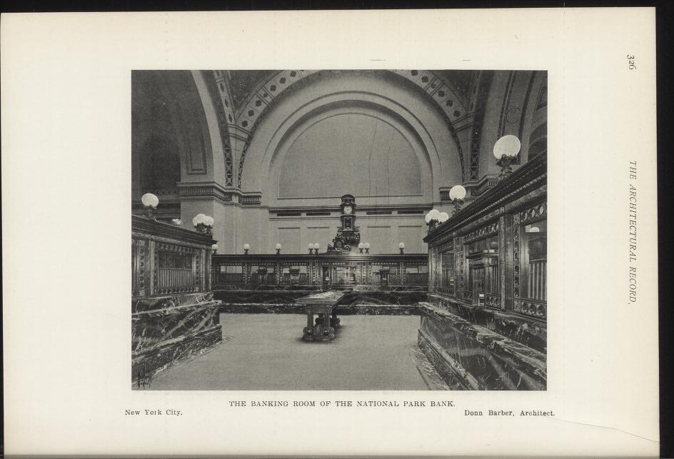 Schwarzes und weißes Foto des Bankettsaal der National Park Bank in New York City, mit Tischen, Lampen, einer Uhr an der Wand und Text unten.