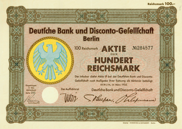 Alte deutsche Banknote mit einer Vogeldarstellung und dem Text "Deutsche Bank und Disconto-Gesellichaft Berlin" darauf.